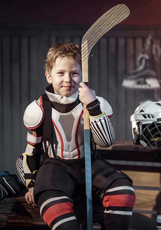 istockphoto-666954882-crop Young sweaty boy in hockey uniform